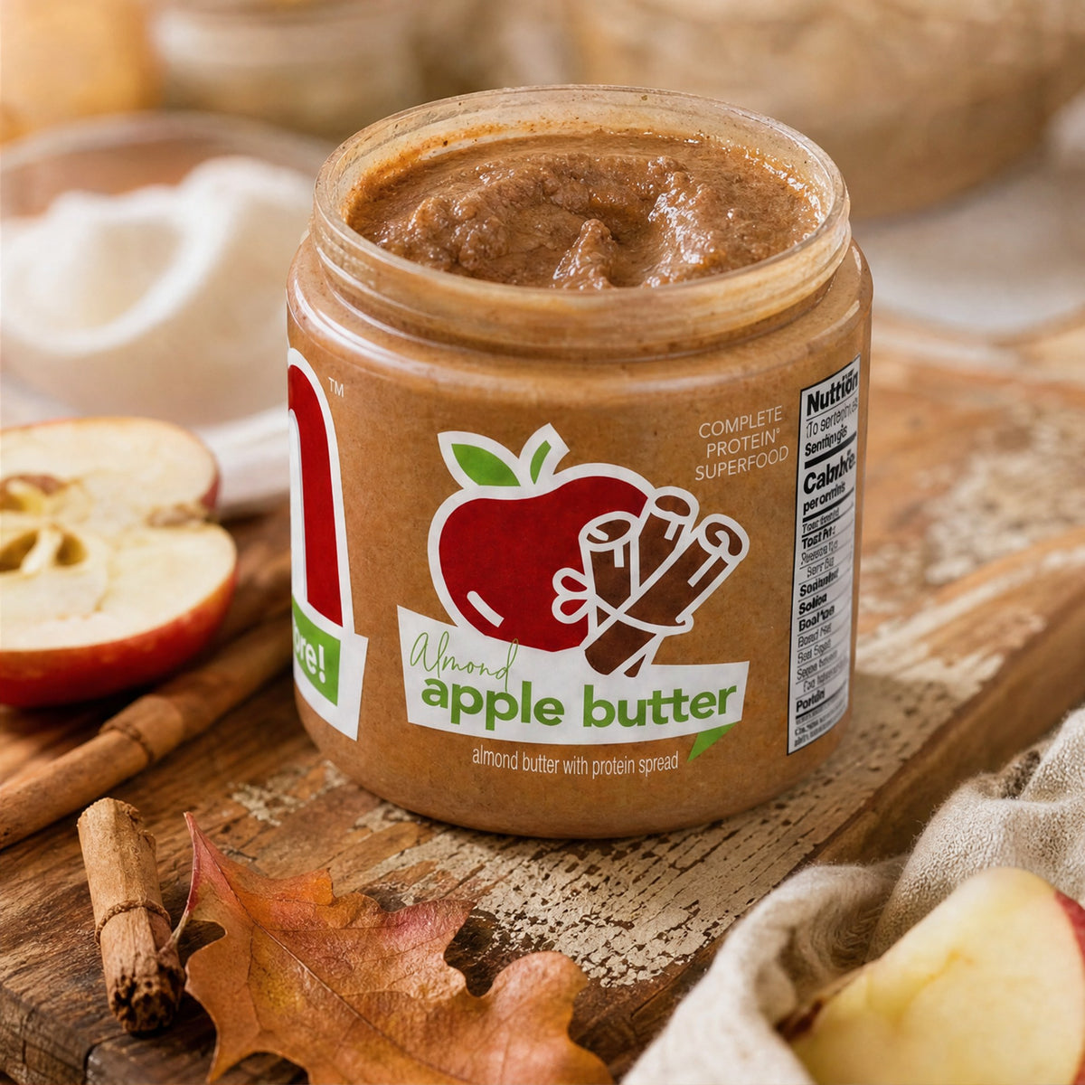 Almond Apple Butter high protein almond butter jar with apple and cinnamon